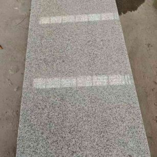 韶关芝麻白光面毛板